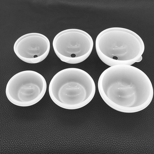 Detailed macro view of 6-piece translucent silicone spherical resin molds on textured surface