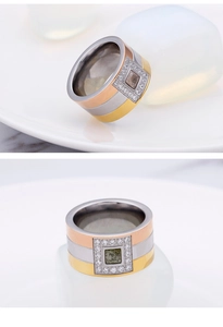 Detail of three-tone titanium steel ring with pavé-set square cubic zirconia stones