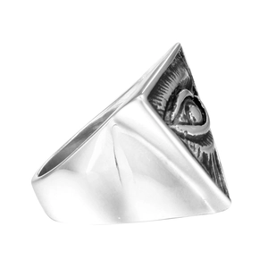 Macro side view of vintage silver steel ring with Triangle Evil Eye embossed detail