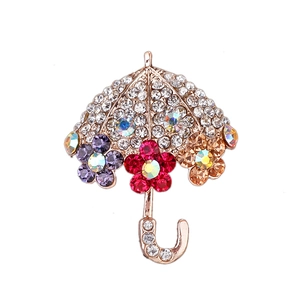 Spilla a forma di ombrello in oro rosa con cristalli e dettagli floreali colorati