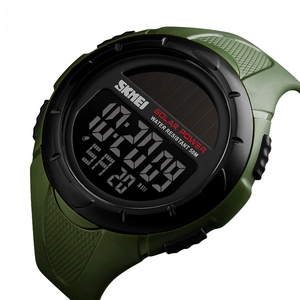 Detail of solar powered digital sports watch showing 50m water resistance and green strap