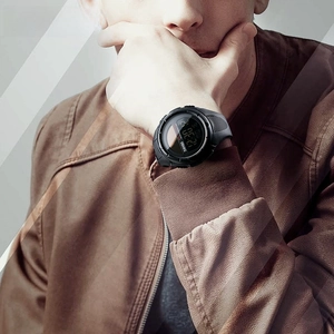 Close-up of solar-assisted digital sport watch with 50M waterproof rating on wrist