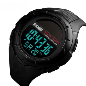 Detail showing the solar panel and digital display on a black waterproof sport watch