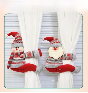 Detailed view of plush snowman and Santa curtain tiebacks with soft knit textures