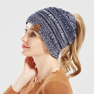 Navy blue mixed knit ponytail beanie with top opening and C.C logo leather patch