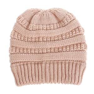 Detailed view of pink knitted beanie featuring horizontal ribbed texture and warm yarn