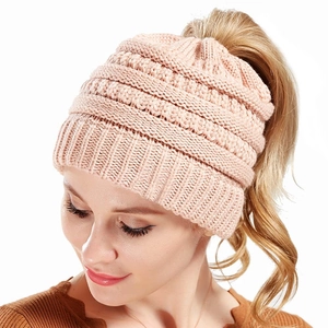 Pink chunky knit ponytail beanie for women with top opening for hair styling