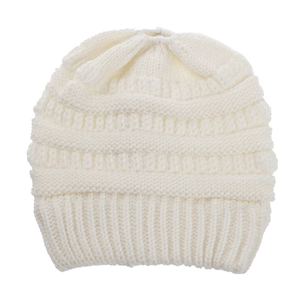 Close-up of white knitted beanie showing mixed rib patterns and soft texture detail