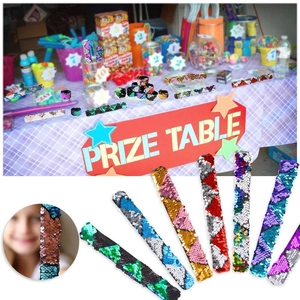 Close-up of kids wearing colorful reversible sequin slap bracelets as fun prize gifts