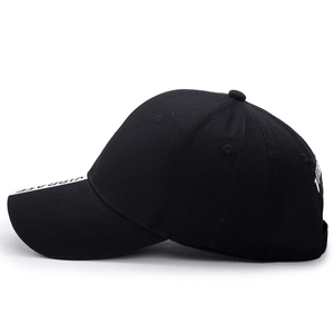Unisex black cotton baseball cap with white VIBRATE side embroidery and street style
