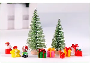 Detailed view of mini sisal Christmas trees and festive resin figurines for micro landscapes