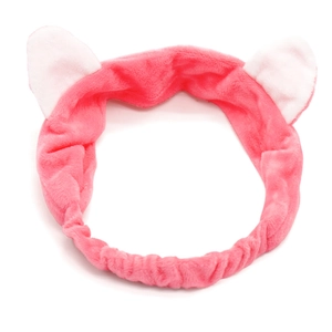 Detail of pink coral fleece elastic headband with soft white cat ears for face washing