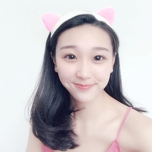 Elastic white headband with pink cat ears for makeup and face washing on a model