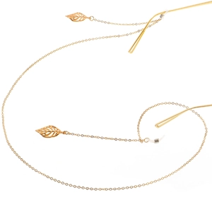 Golden anti-slip metal eyewear chain featuring hollow leaf pendants and silicone loops