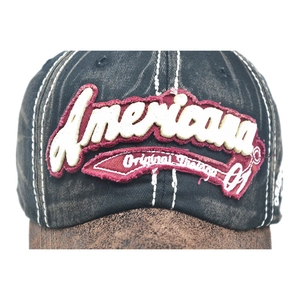Vintage Americana baseball cap featuring washed black cotton and brown distressed peak