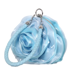 Detailed view of light blue satin rose handbag with woven handle and silver hardware