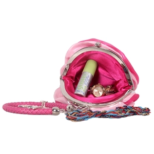 Internal view of pink silk flower evening bag showing storage capacity and metal clasp