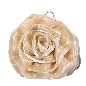 Detailed view of champagne silk organza 3D rose flower with silver metal hanging loop