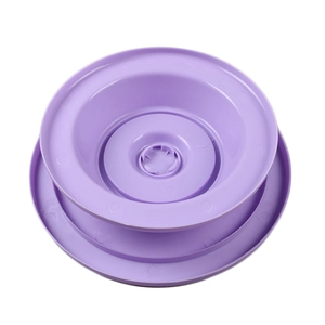 Detailed top view of the purple rotating cake turntable base with concentric ring patterns