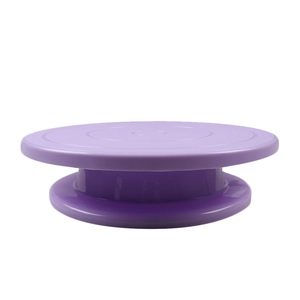 Detail view of purple circular plastic cake turntable with a stable base for decorating