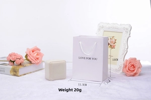 White jewelry gift set with 'Love For You' paper bag and elegant square velvet ring box