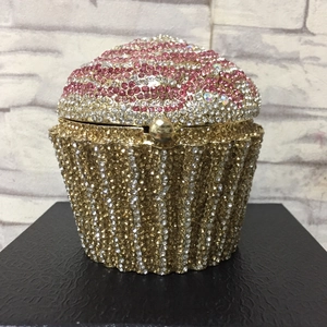Detail of cupcake shaped evening clutch featuring pink, silver and gold rhinestone inlay