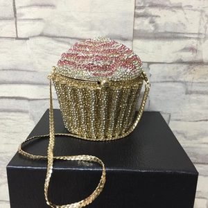 Detailed close-up of cupcake clutch bag with sparkling pink and gold rhinestone crystals