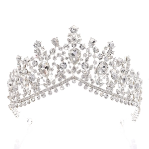 Macro detail of silver bridal crown with baroque crystals and drop-shaped central rhinestone