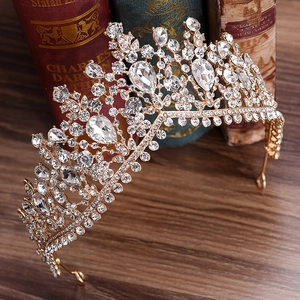 Close-up of luxury bridal crown with brilliant rhinestones on vintage book background