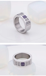 Detail view of a silver titanium ring featuring a square purple stone and side diamonds