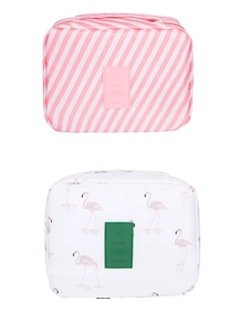 Detail of travel makeup bags featuring pink stripes and flamingo patterns with logo labels