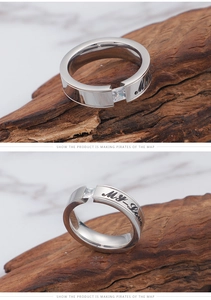 Macro detail of silver stainless steel couple ring with square zircon and MY LOVE engraving