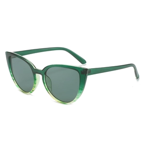 Retro cat-eye sunglasses with translucent green resin frames and dark gray lenses