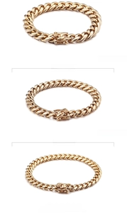 Detail of 18K gold plated Cuban chain bracelets in 8mm and 10mm widths with spring clasps