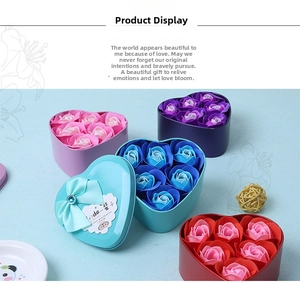 Detail of heart-shaped soap rose gift boxes with ribbons in multiple pastel colors