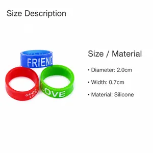 Detail of colorful silicone rings with Friend, Luck, and Love engravings, 2cm diameter