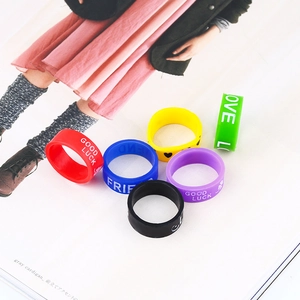 Set of six colorful silicone rings featuring motivational words like Love and Good Luck