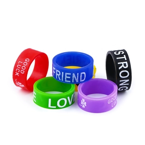 Set of six colorful silicone sport rings featuring inspirational words and clover motifs
