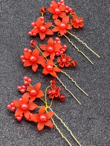 Set of three bridal U-shaped hair pins with red resin flowers and gold wire details