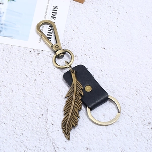 Vintage bronze feather keychain with black genuine leather strap and metal spring clasp