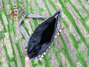 Top view of ethnic embroidery crossbody bag showing black lining and zipper detail