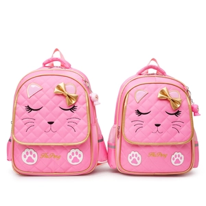 Pink cat-themed school backpack for girls featuring gold bow and embroidery details