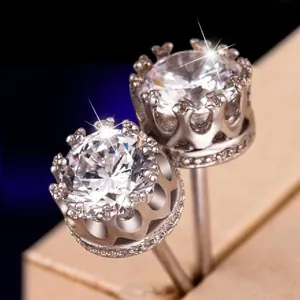 Detailed view of elegant silver crown stud earrings with sparkling cubic zirconia