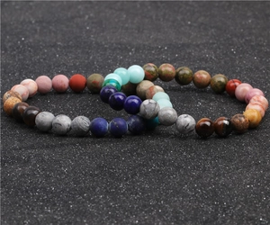 Detail of bohemian natural stone bead bracelet set with tiger eye and lapis lazuli stones
