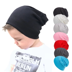 Detailed grid of soft cotton slouchy beanies for kids in eight diverse solid colors
