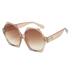 Irregular hexagonal oversized sunglasses with brown gradient lenses and gold metal accents