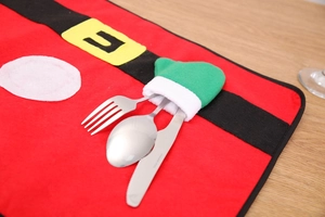Christmas table mat and cutlery holder set featuring Santa belt felt design on wood background
