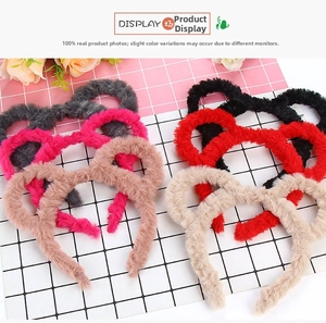 Close-up of soft plush bear ear headbands in gray, pink, brown, black, red, and beige colors