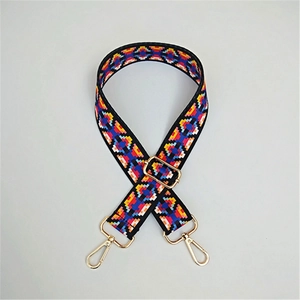 Adjustable wide woven bag strap with colorful geometric patterns and gold lobster clasps