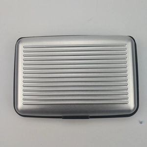 Waterproof aluminum card holder in silver gray with ribbed texture and secure buckle